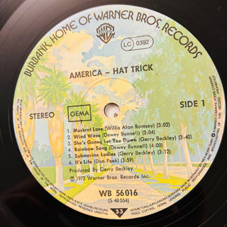America ‎– Hat Trick LP mit OIS (NM) - schallplattenparadis